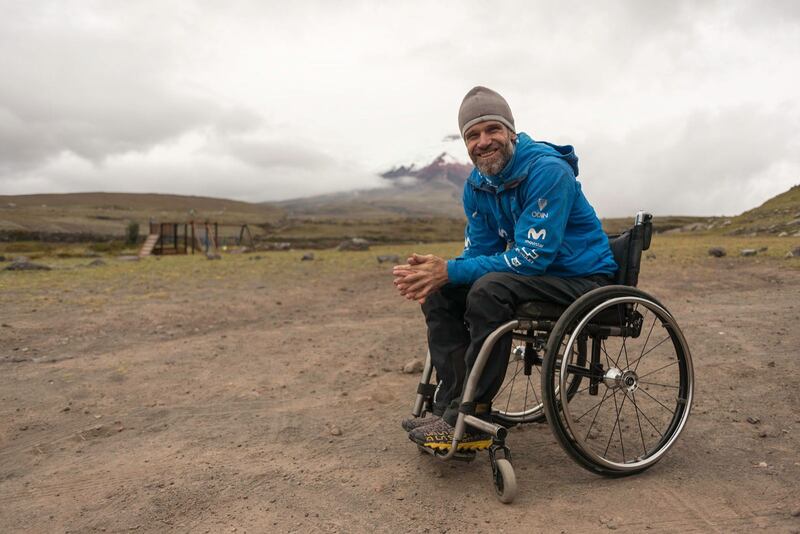 Zuko Carrasco outdoors in a wheelchair on an open mountain landscape
