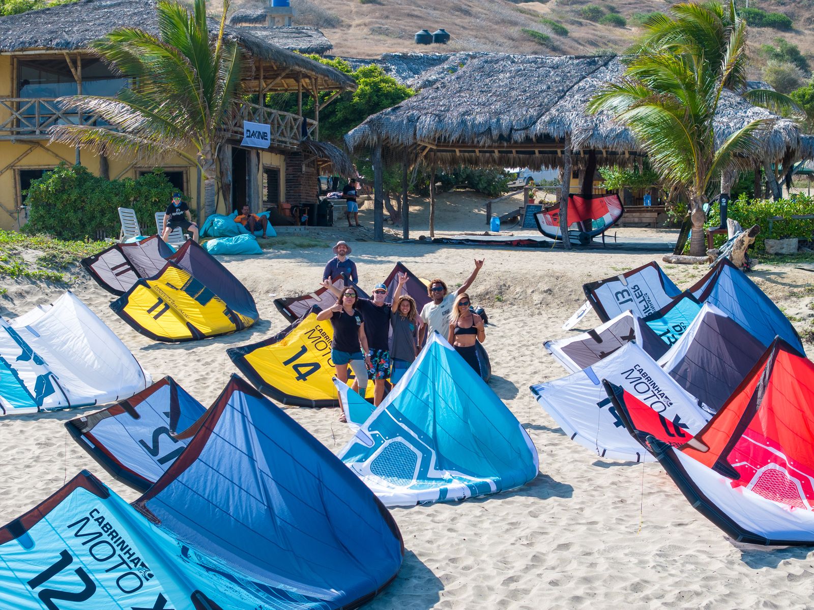 Group of kitesurfers on the beach