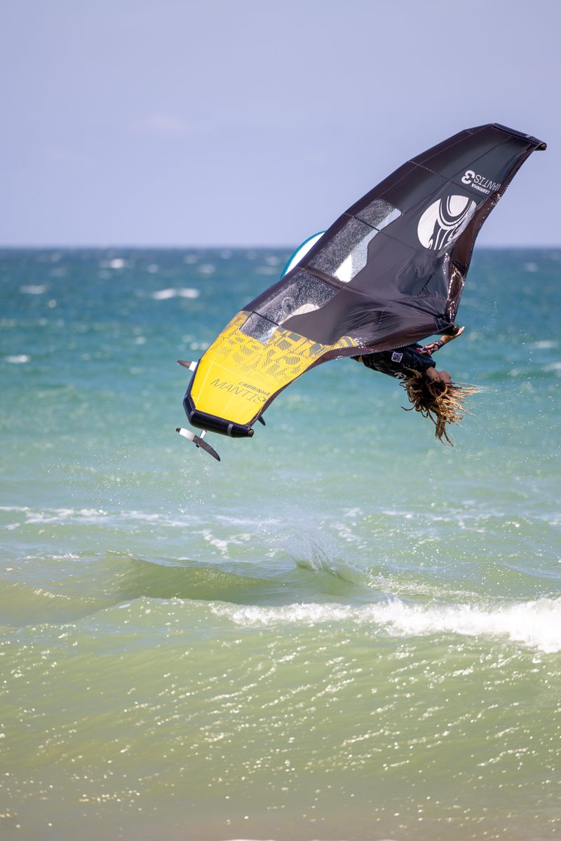 Kitesurfer performing an inverted trick